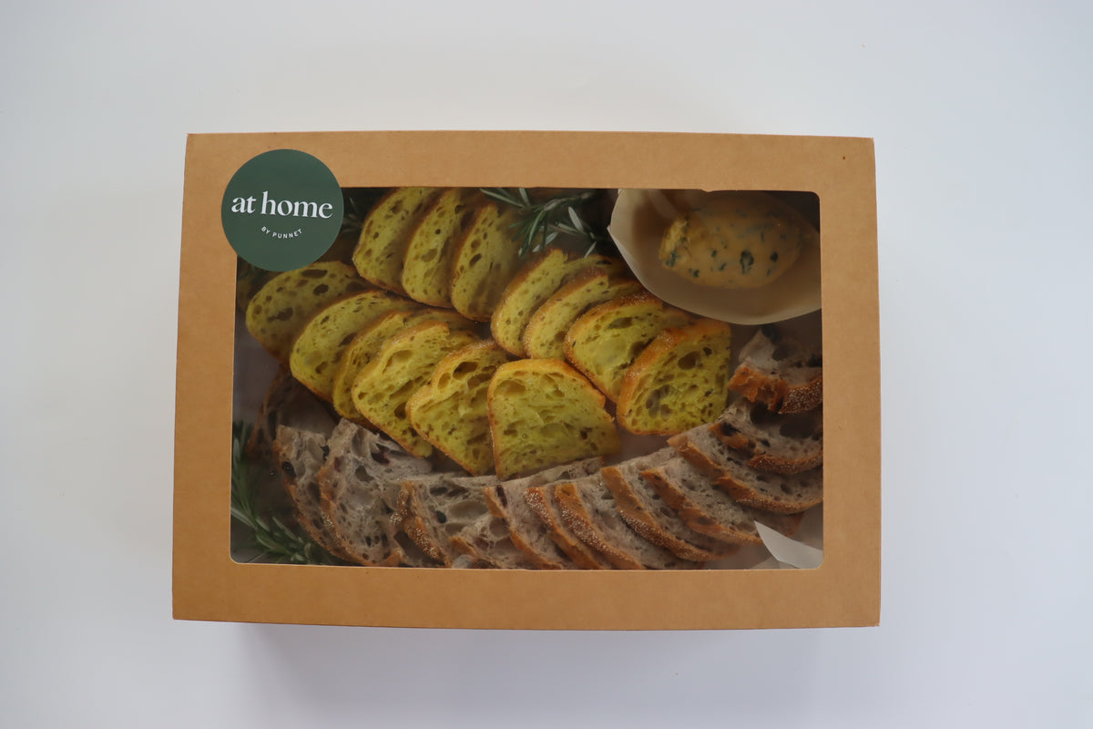 Volare bread selection with confit garlic and herb butter Eatery