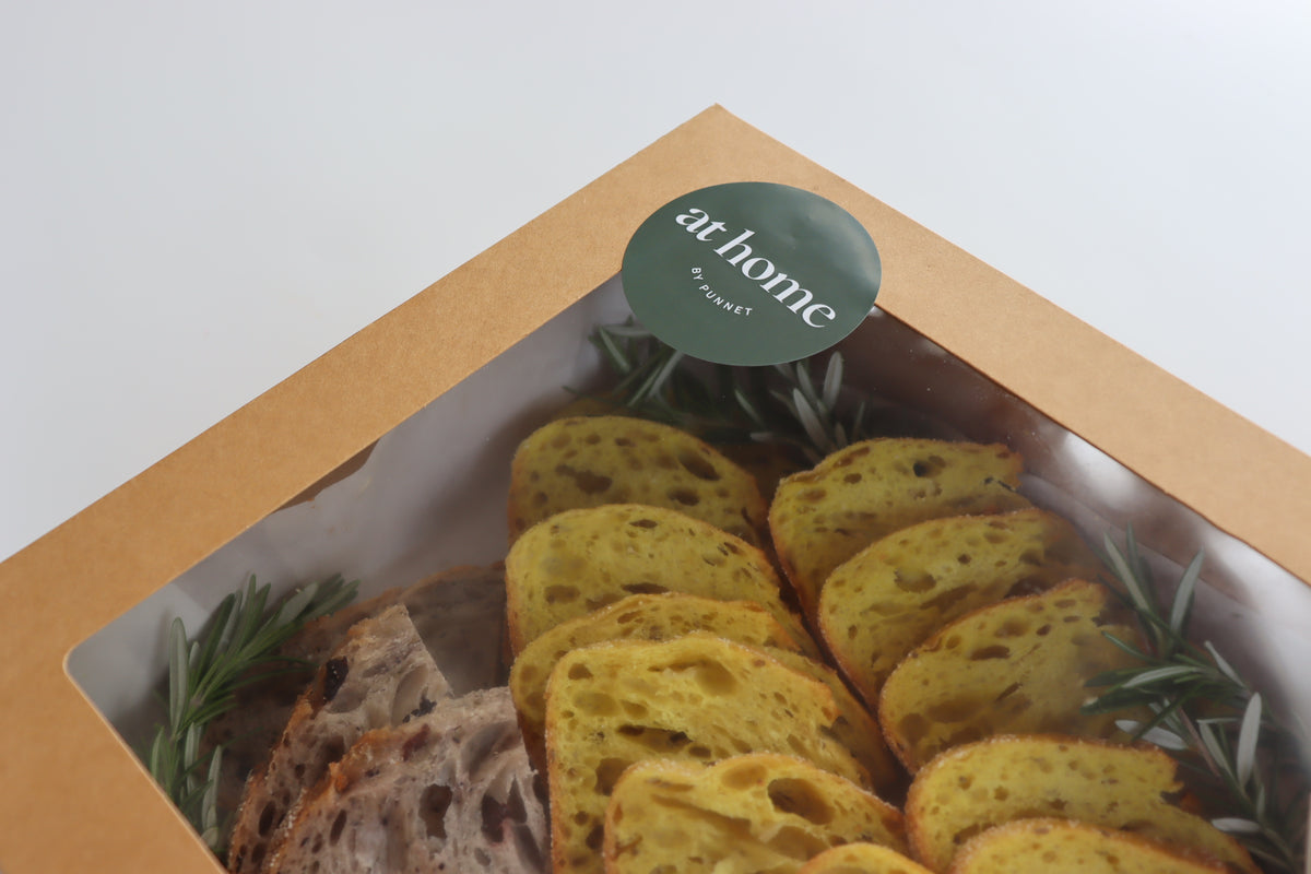 Volare bread selection with confit garlic and herb butter Eatery